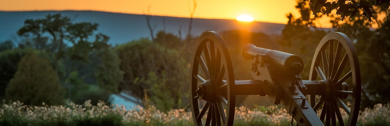 Civil war era cannon at sunset